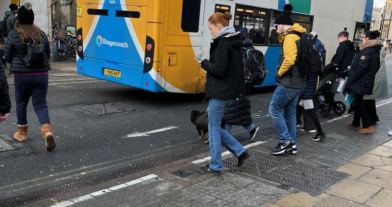 Pedestrians in conflict with buses while trying to cross St. Andrew's Street